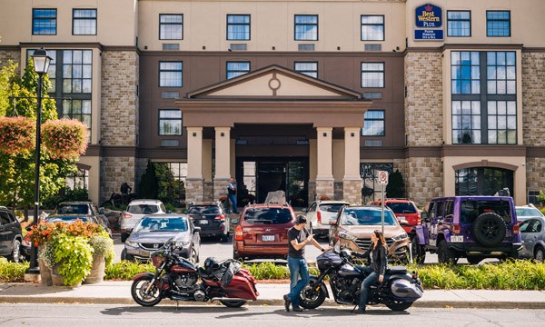  two motorcycles in front of hotel