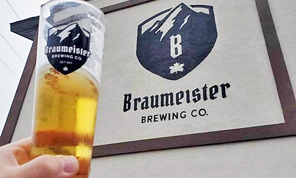 Beer in front of building sign