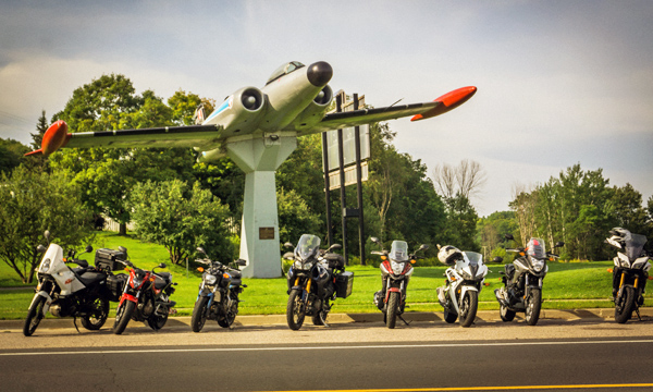 Motorcycles in front of the CF-100 Canuck war monument