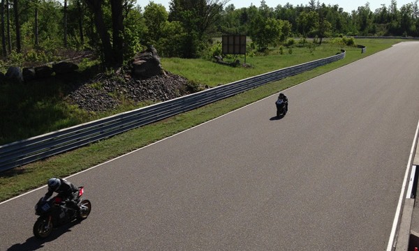 Two motorcycles riding on Calabogie Motorsports Park track 