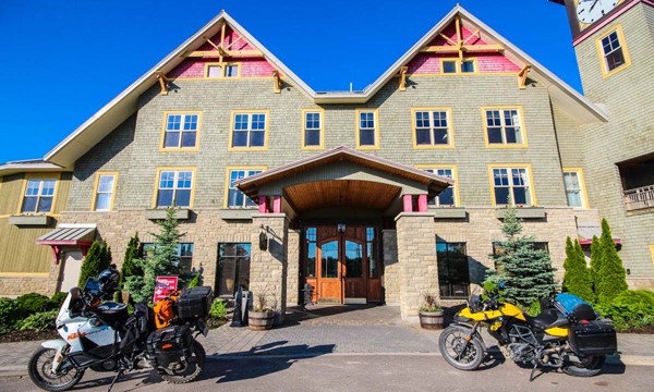  Two motorcycles in front of brick building