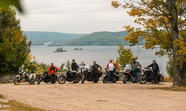 Motorcycle riders in front of Kamaniskeg Lake