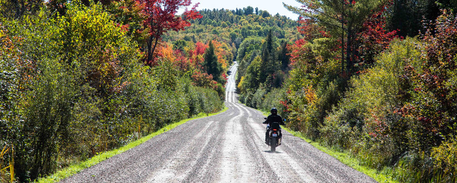 ADV bike riding on a gravel road