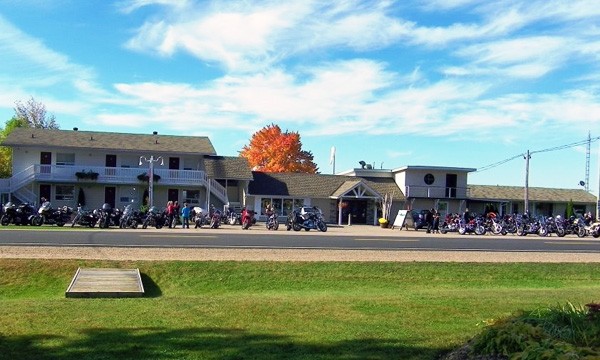 Front of lodge with motorcycles