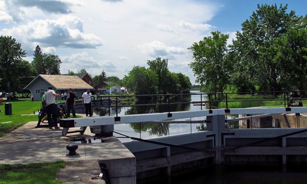  People standing by canal lock