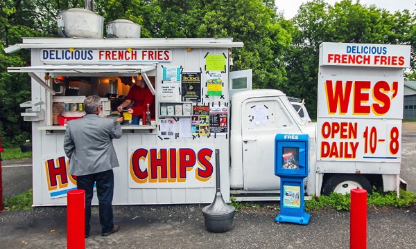 Man purchasing food at a chip truck